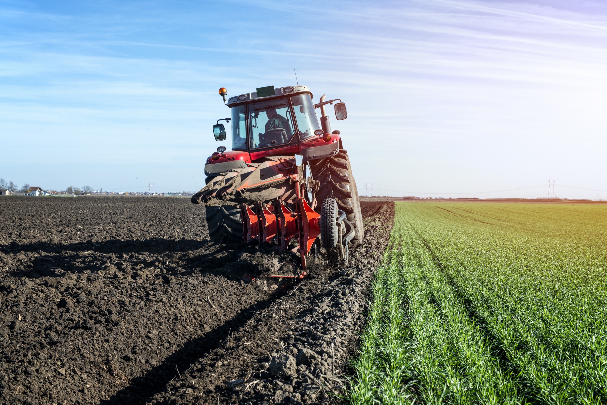 Agricultural field with farming equipment